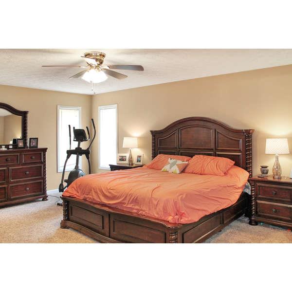 398 Strawberry Ridge Manchester, TN 37355 - Photo 8 of 30 a bedroom with a bed and a chandelier