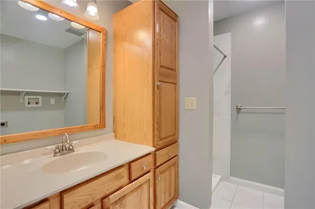 a bathroom with a sink and a mirror