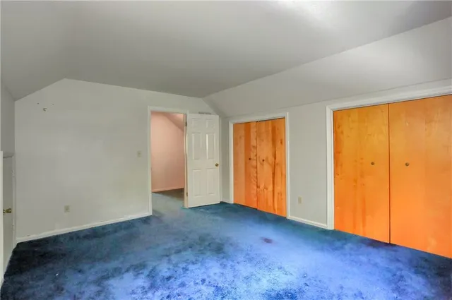 an empty room with closet area
