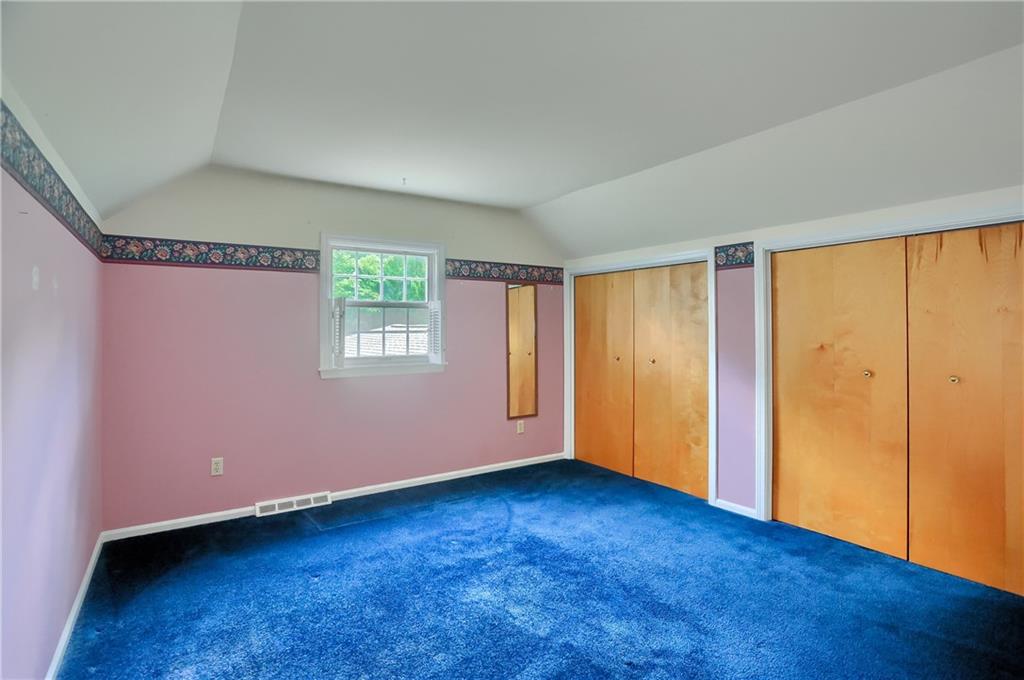9650 Goehring Road Cranberry Township, PA 16066 - Photo 32 of 47 a view of an empty room with wooden floor and a window