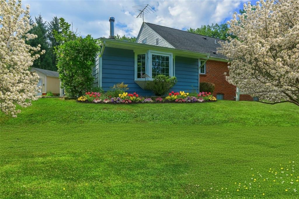 9650 Goehring Road Cranberry Township, PA 16066 - Photo 37 of 48 a front view of house with yard and green space