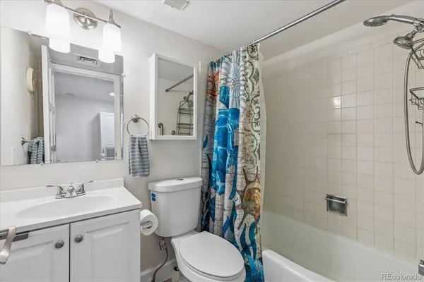 a utility room with sink dryer and washer