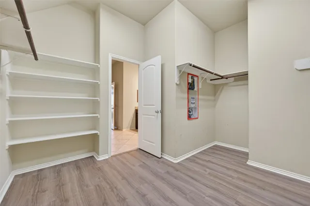 a view of an empty walk in closet