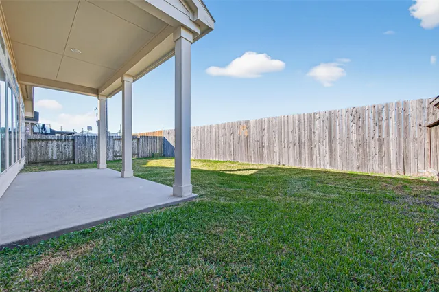 a view of backyard with porch