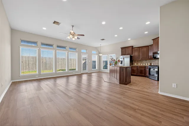 a view of kitchen with furniture and wooden floor