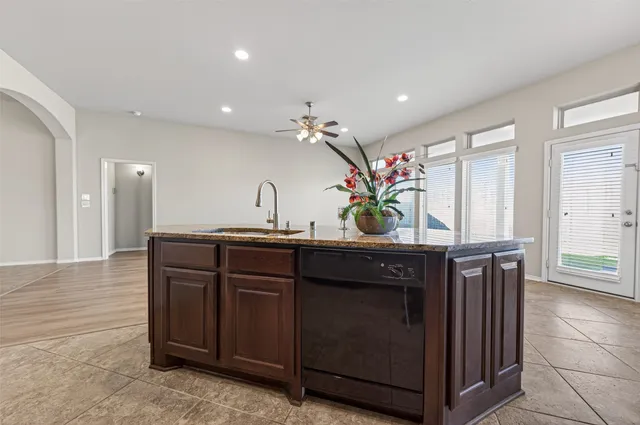 a kitchen with a sink and a refrigerator