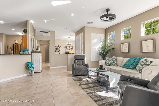 a living room with furniture and a table