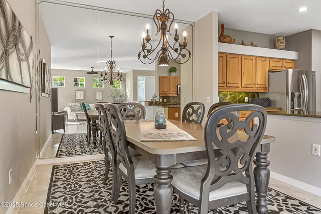 a view of a dining room and hall with furniture