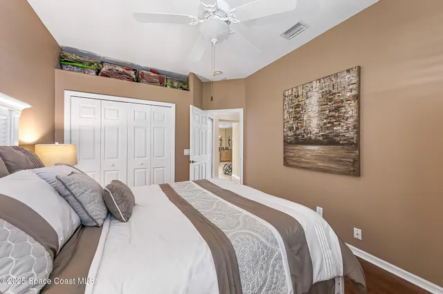 a bedroom with bed and window