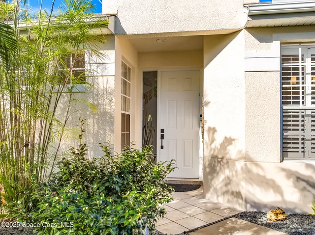 a view of a brick house with windows