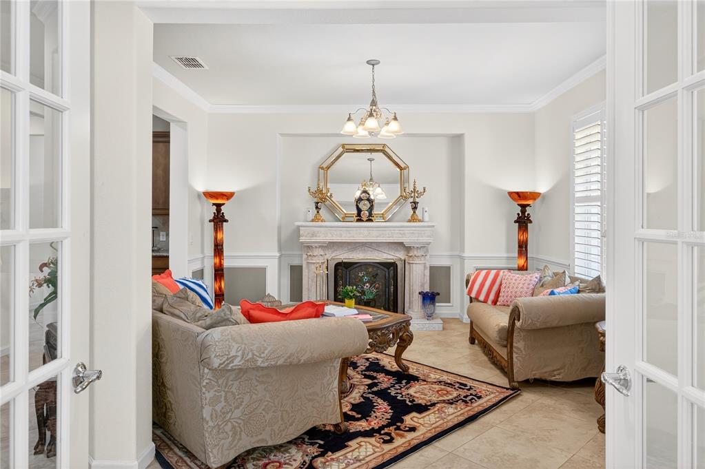 7527 Southwest 97th Terrace Road Ocala, FL 34481 - Photo 16 of 85 a living room with furniture and a fireplace