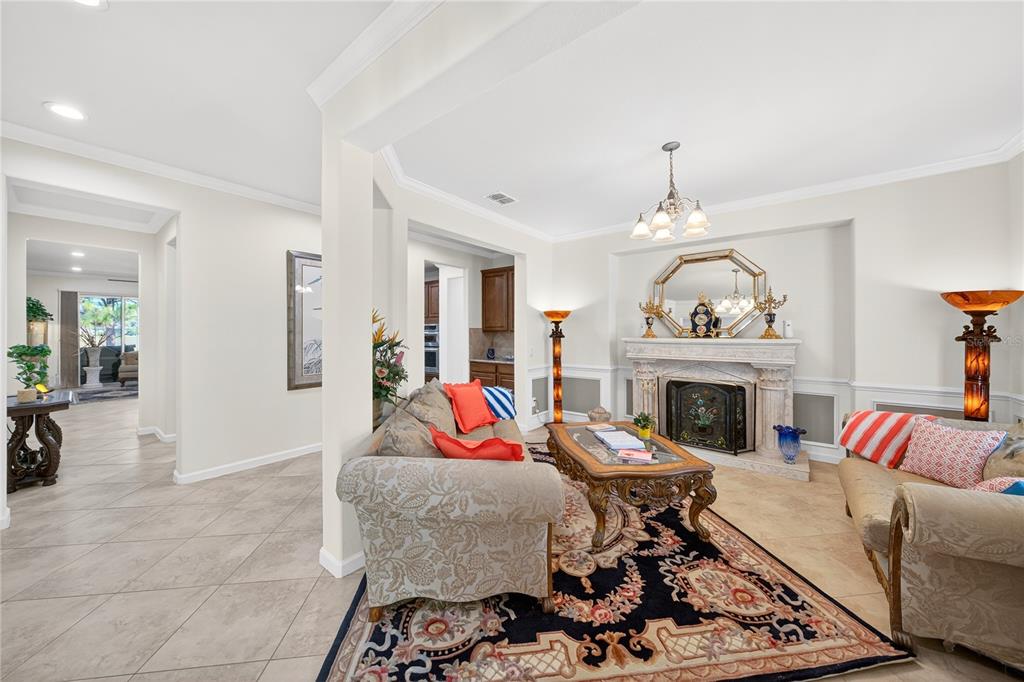7527 Southwest 97th Terrace Road Ocala, FL 34481 - Photo 18 of 85 a living room with furniture and a fireplace