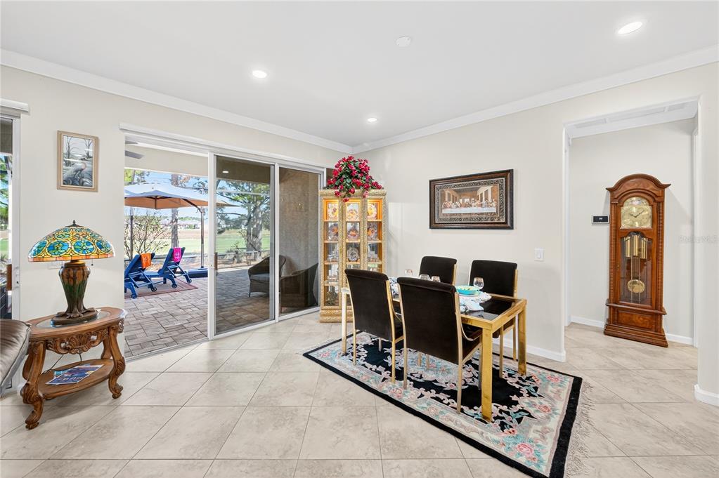 7527 Southwest 97th Terrace Road Ocala, FL 34481 - Photo 24 of 85 a living room with furniture a computer on a desk and bookshelf
