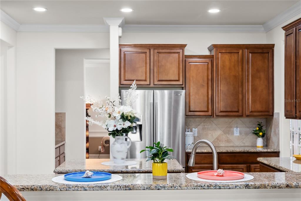 7527 Southwest 97th Terrace Road Ocala, FL 34481 - Photo 31 of 85 a kitchen with stainless steel appliances granite countertop a refrigerator and a sink