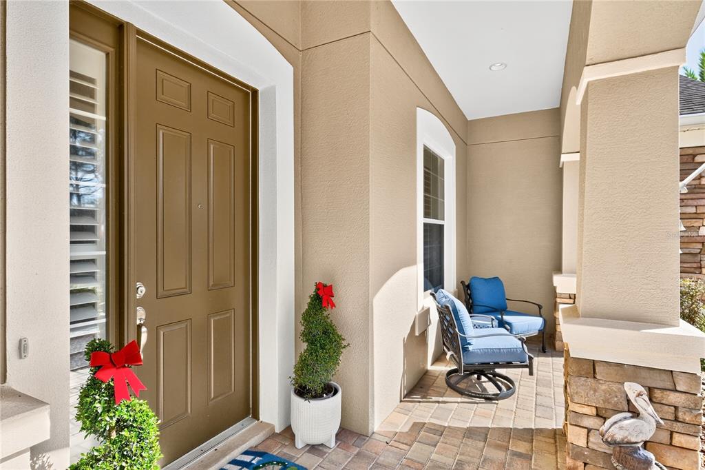 7527 Southwest 97th Terrace Road Ocala, FL 34481 - Photo 5 of 85 a view of a entryway with flower pots