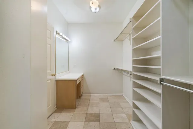 a view of an empty walk in closet