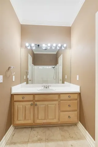 a bathroom with a sink double vanity and a mirror