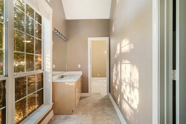 a room with a window and a washer dryer