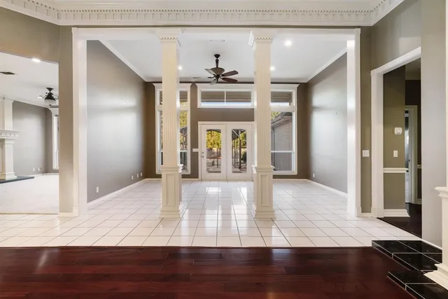 a view of a hallway view with wooden floor and staircase