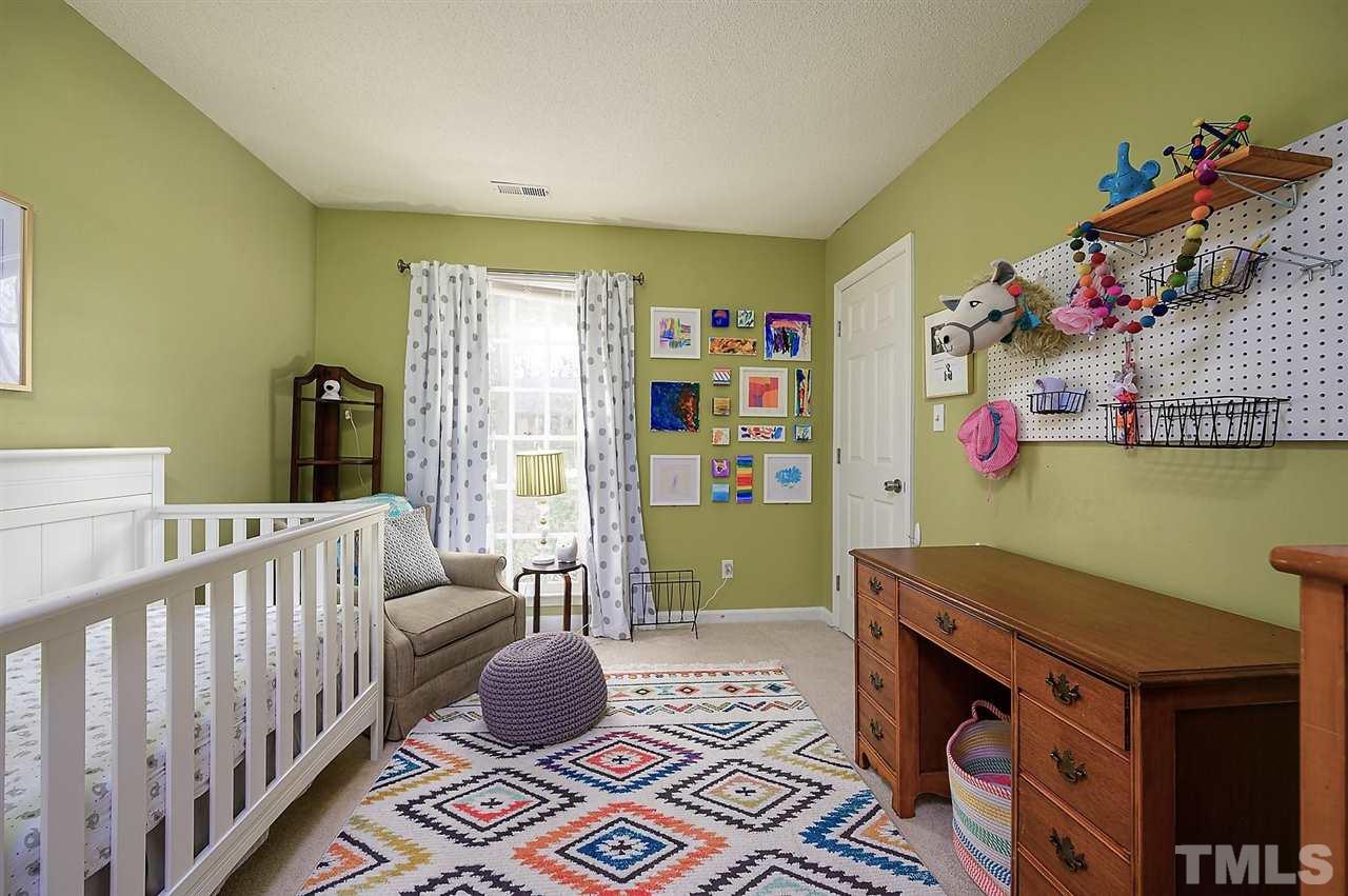 11917 North Exeter Way Raleigh, NC 27613 - Photo 13 of 18 a living room with furniture and a window