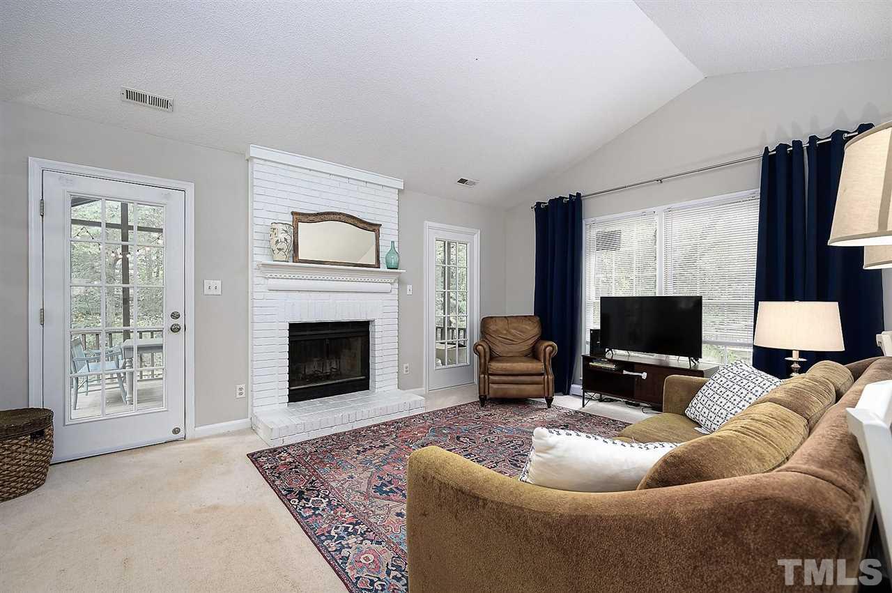 11917 North Exeter Way Raleigh, NC 27613 - Photo 5 of 18 a living room with furniture and a fireplace