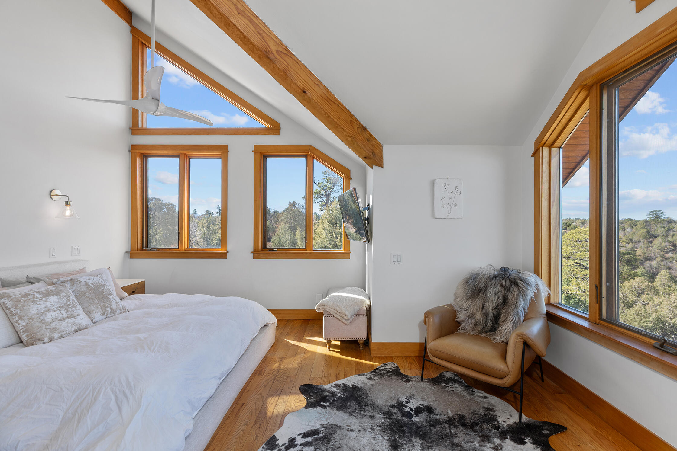 2699 County Road Norwood, CO 81423 - Photo 17 of 64 a bedroom with a bed and a couch next to a window