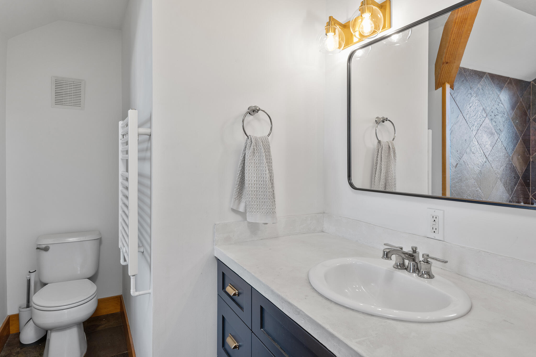 2699 County Road Norwood, CO 81423 - Photo 21 of 64 a bathroom with a toilet sink and mirror