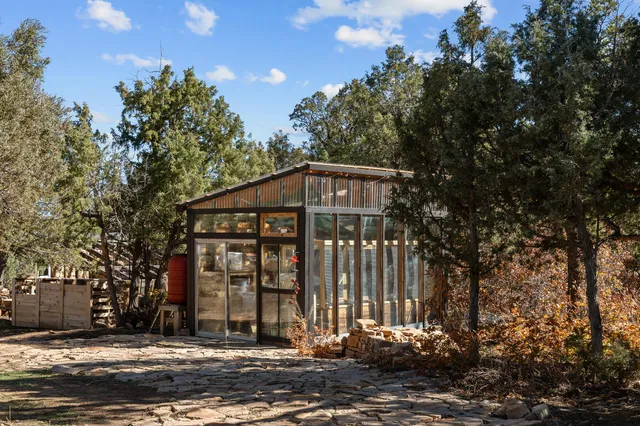 a view of a backyard with swimming pool