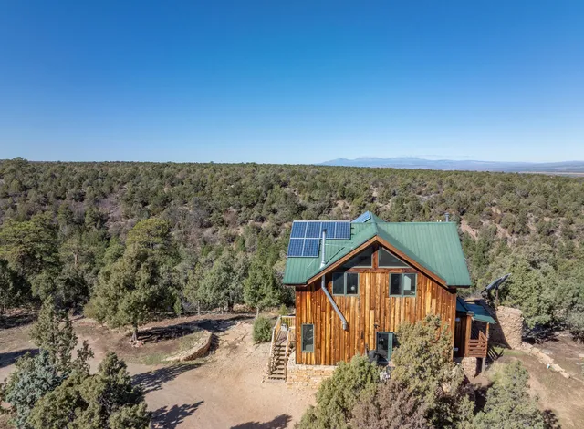 a view of a house with a mountain in the background