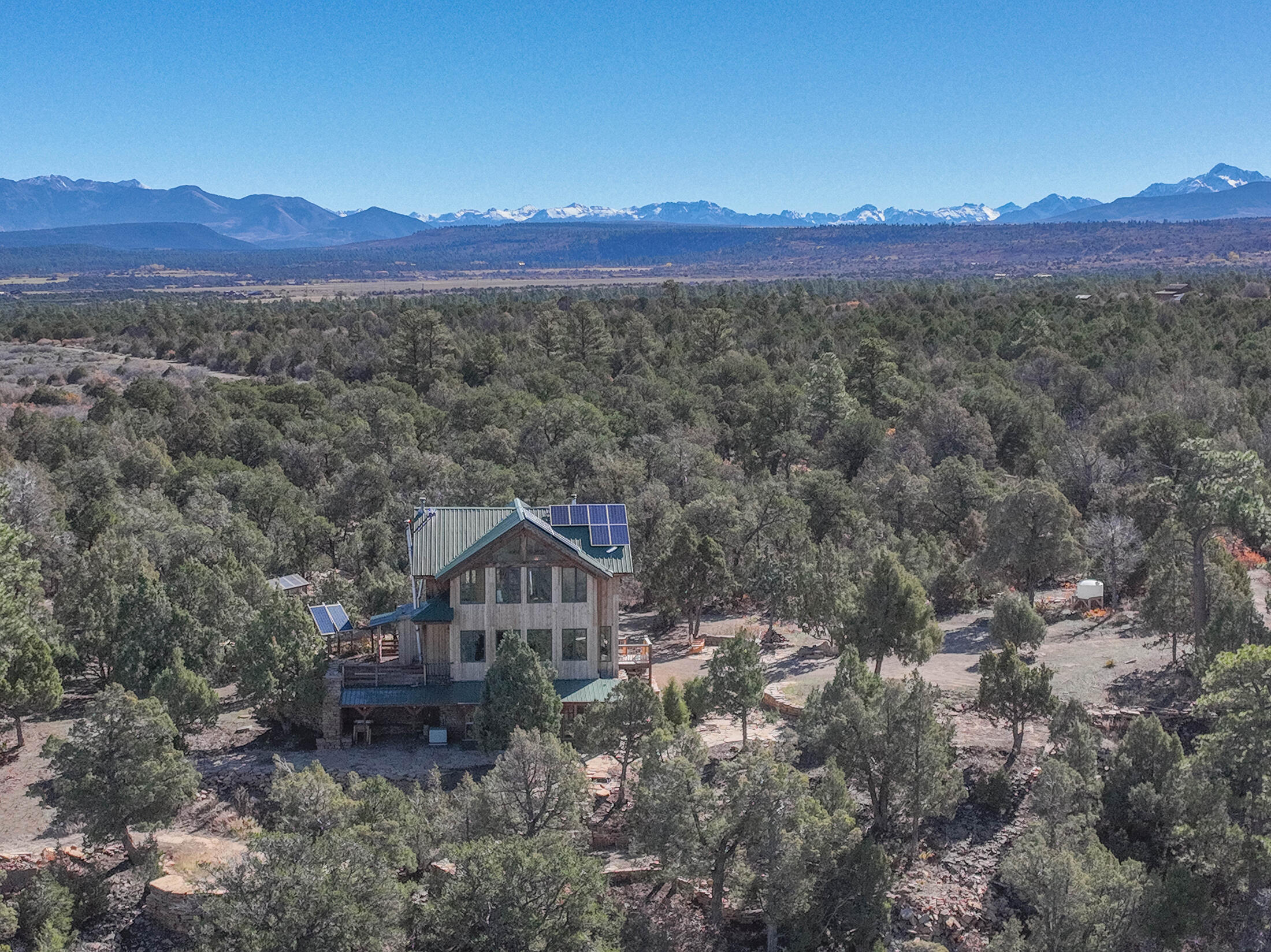 2699 County Road Norwood, CO 81423 - Photo 48 of 64 a view of a house with a mountain in the background