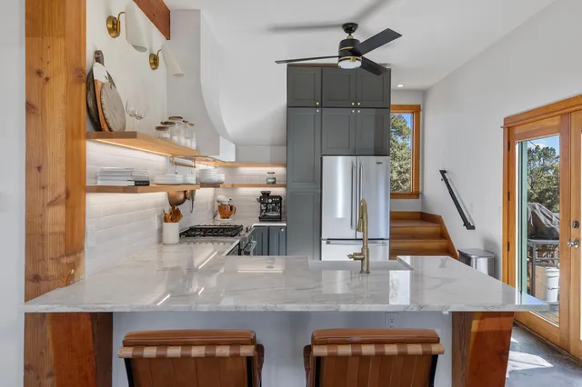 a view of living room with furniture and wooden floor