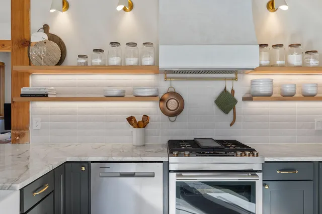 a kitchen with a stove and cabinets