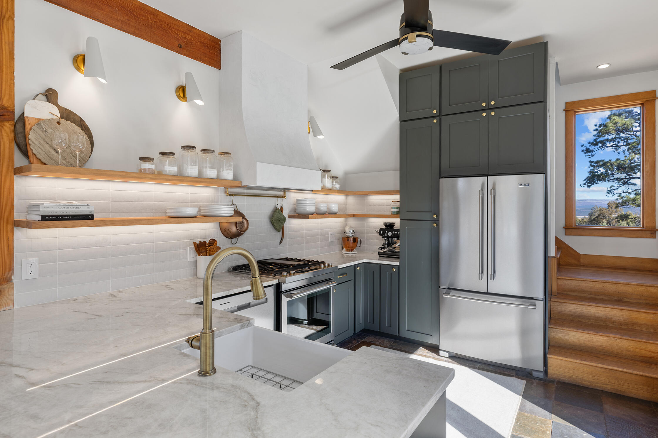 2699 County Road Norwood, CO 81423 - Photo 9 of 64 a kitchen with stainless steel appliances granite countertop a refrigerator and a stove top oven