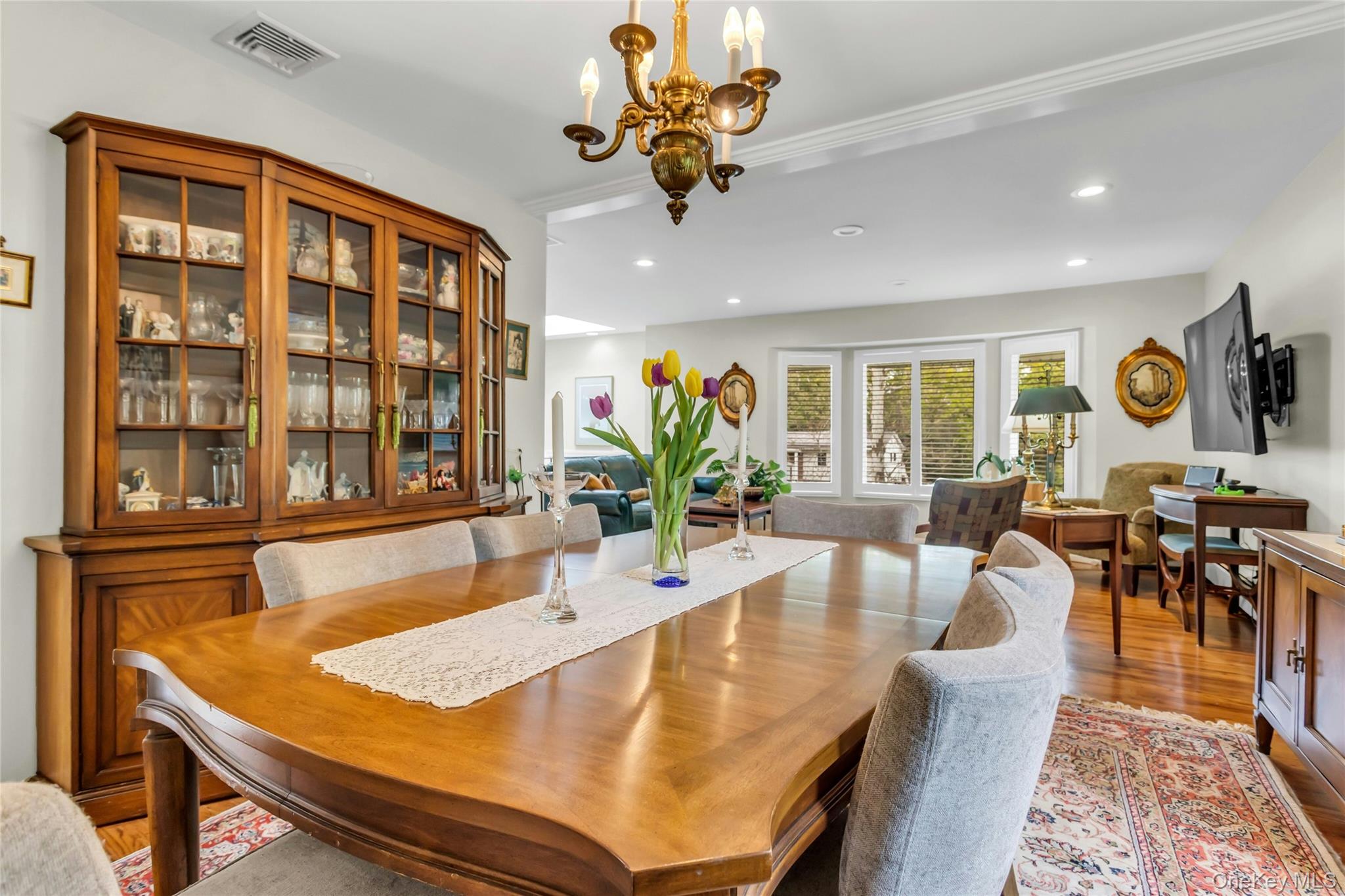 28 Penguin Lane Commack, NY 11725 - Photo 13 of 38 a view of a dining room with furniture window and wooden floor