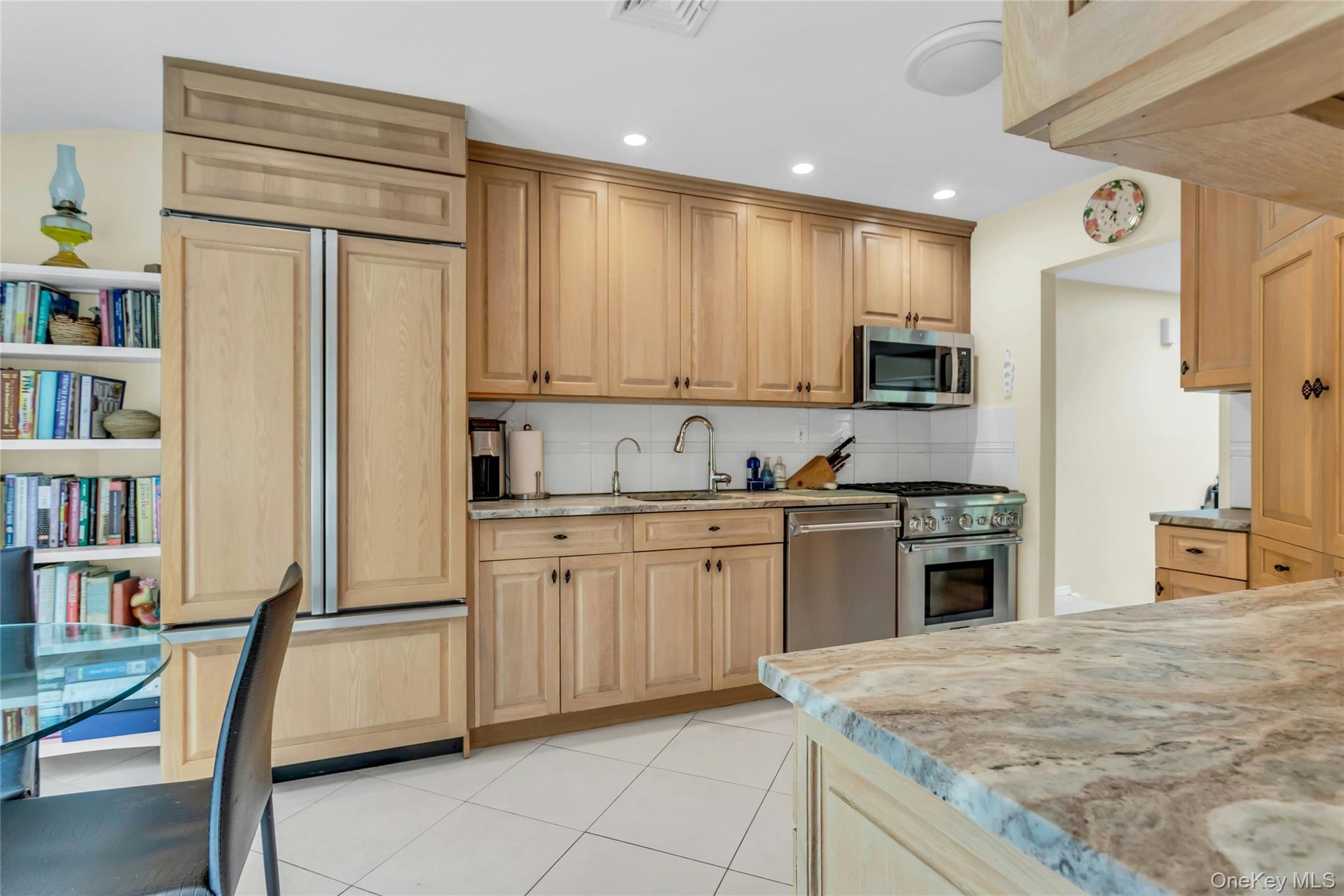 28 Penguin Lane Commack, NY 11725 - Photo 15 of 38 a kitchen with stainless steel appliances granite countertop a refrigerator sink and cabinets