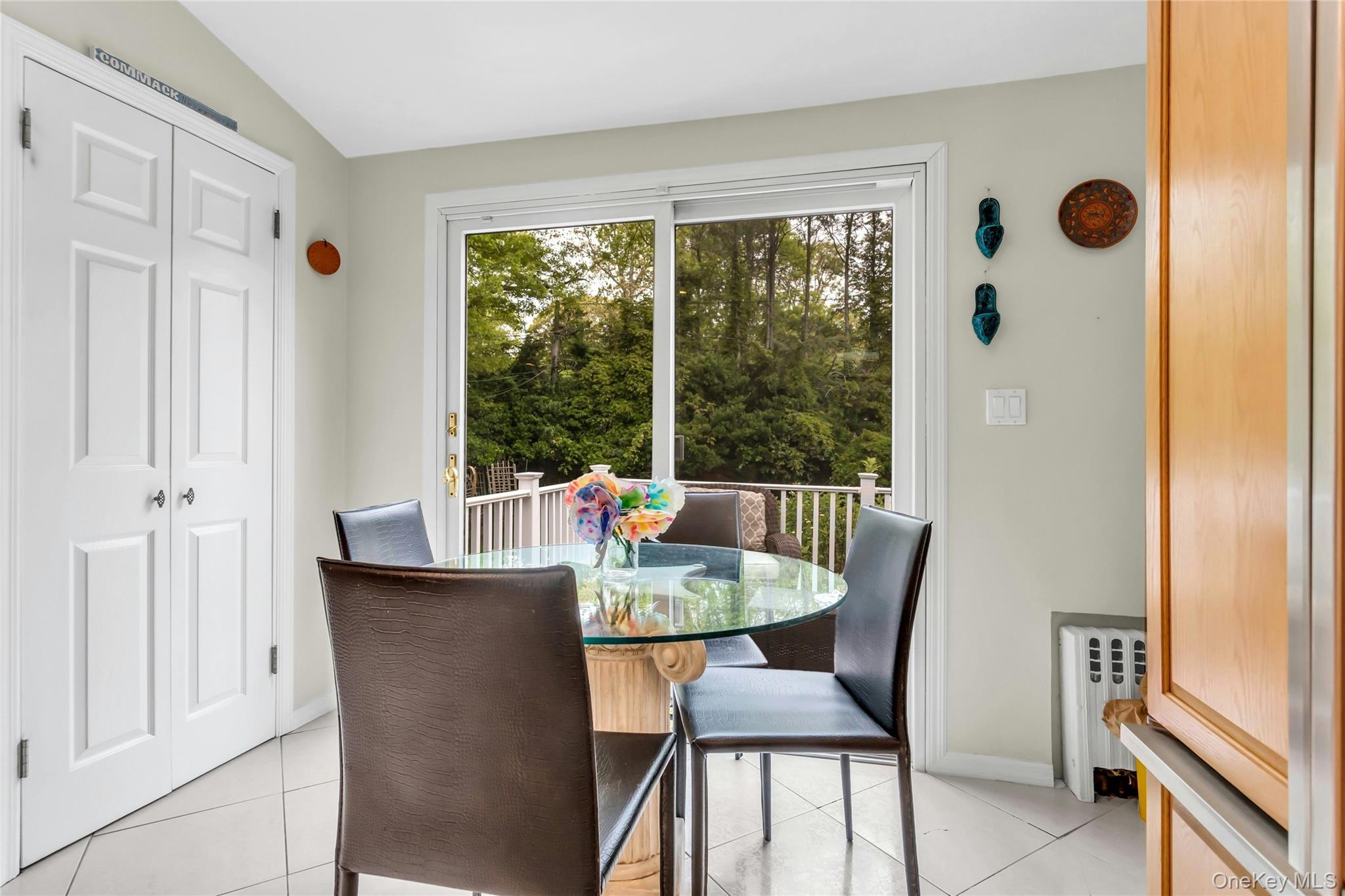 28 Penguin Lane Commack, NY 11725 - Photo 18 of 38 a dining room with furniture and a window