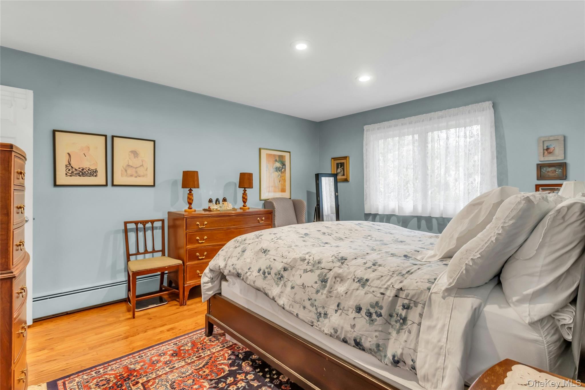 28 Penguin Lane Commack, NY 11725 - Photo 20 of 38 a bed room with a bed and a chair