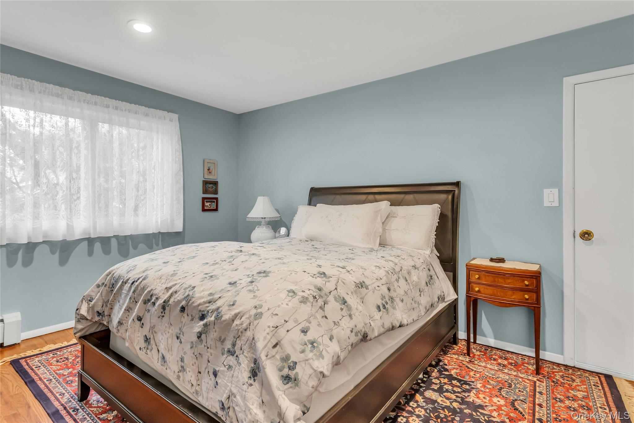 28 Penguin Lane Commack, NY 11725 - Photo 21 of 38 a bedroom with bed and window
