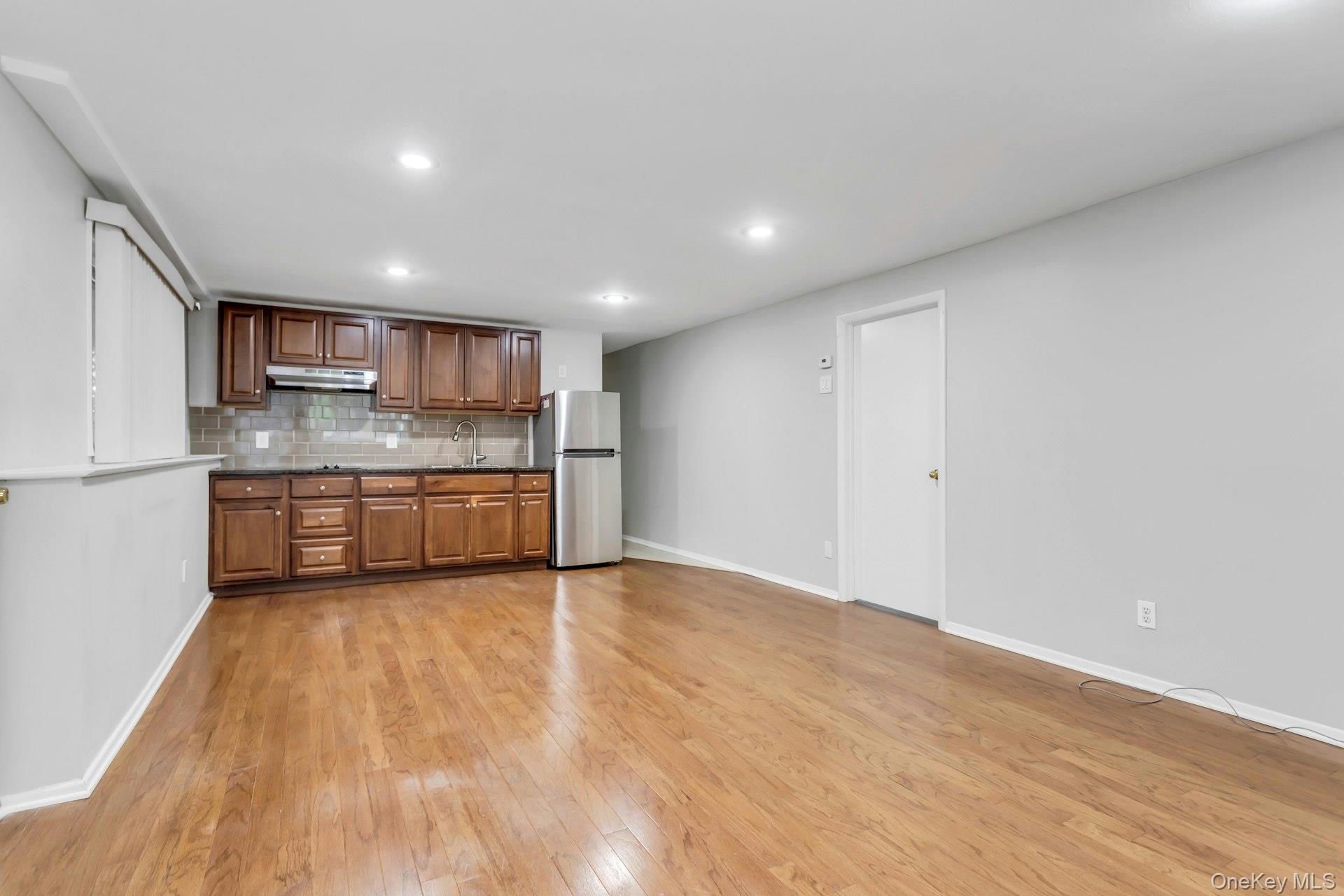 28 Penguin Lane Commack, NY 11725 - Photo 28 of 38 a view of kitchen with wooden floor