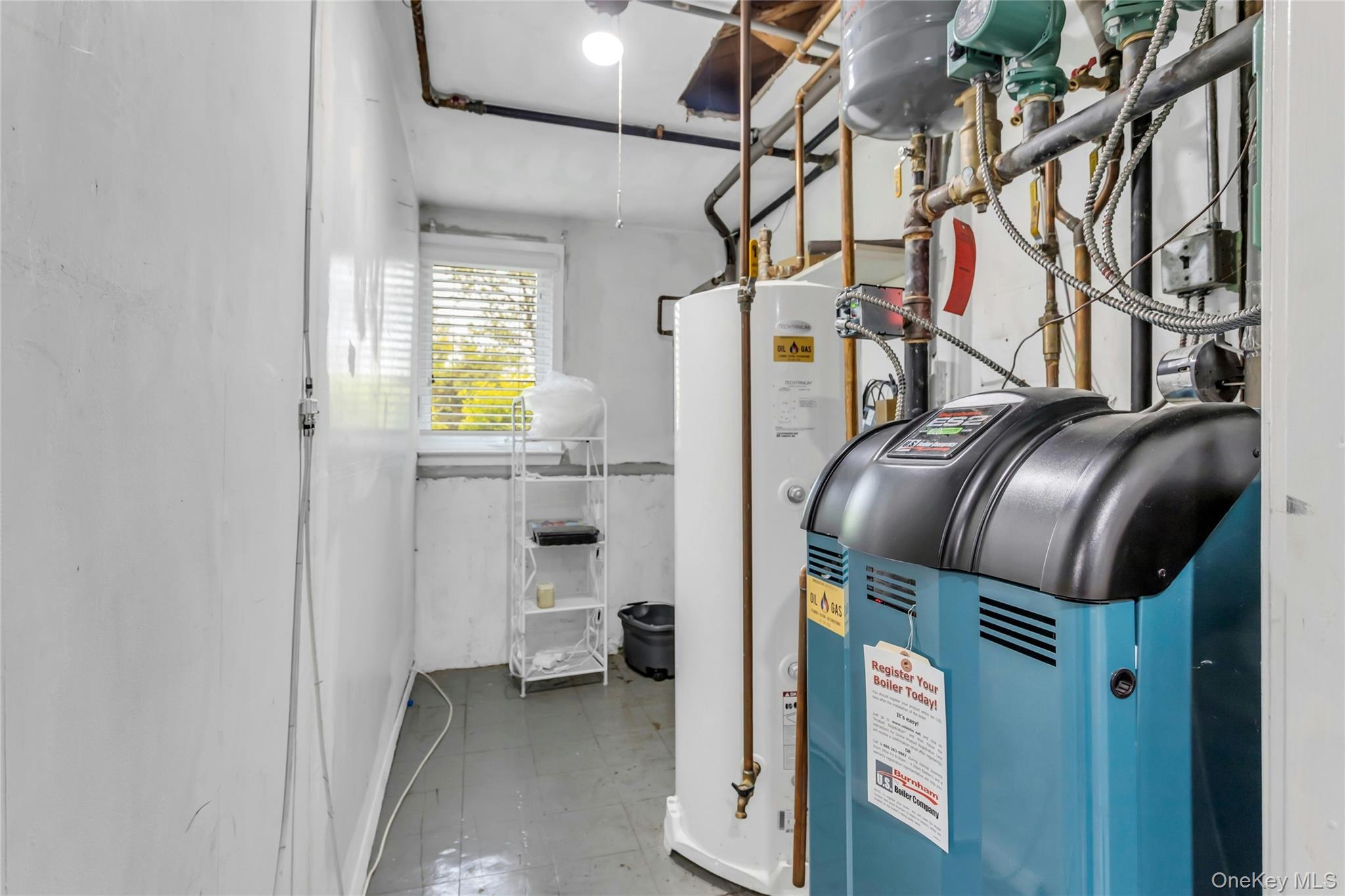28 Penguin Lane Commack, NY 11725 - Photo 31 of 38 a utility room with dryer and washer