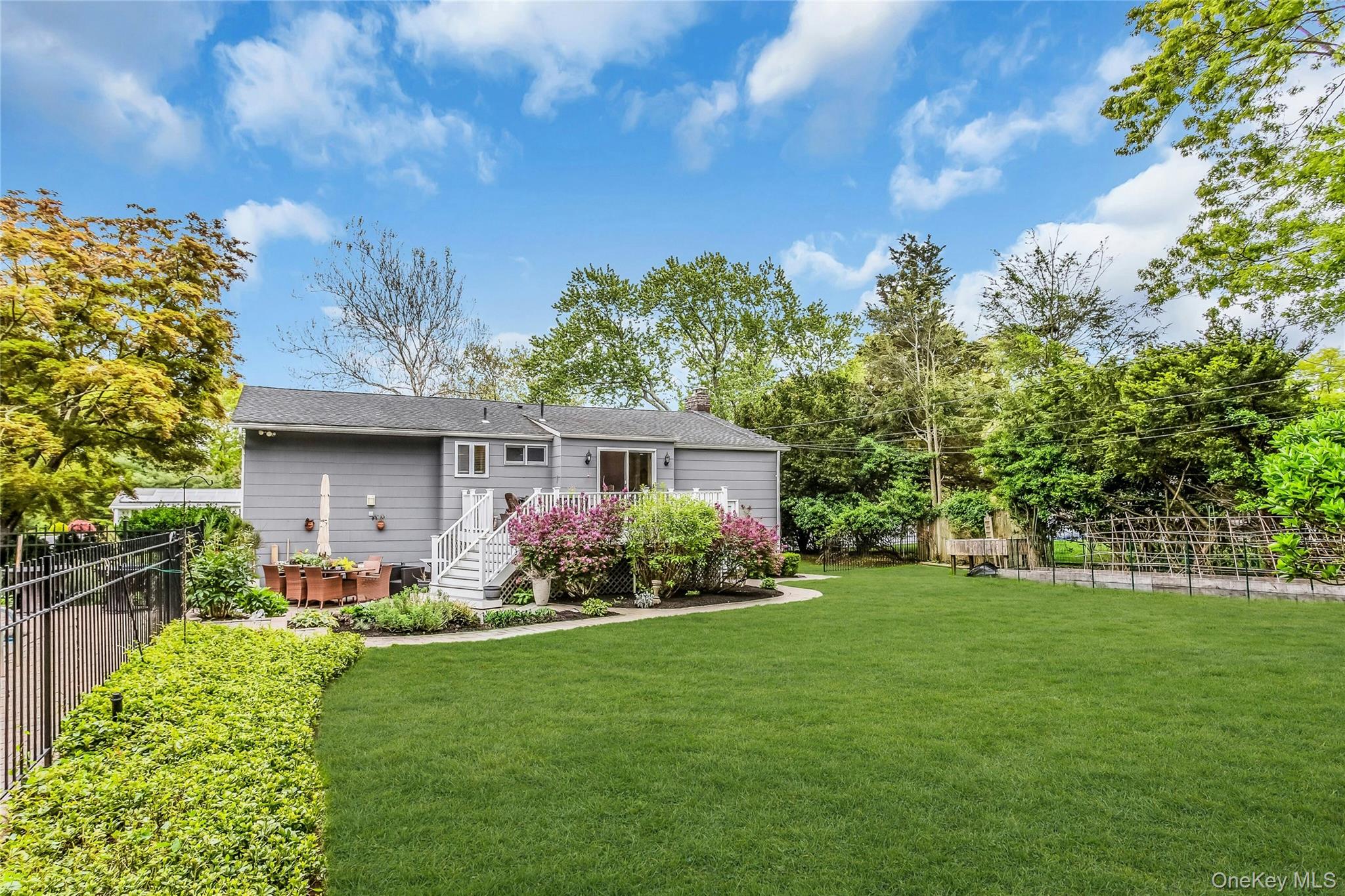28 Penguin Lane Commack, NY 11725 - Photo 34 of 38 a front view of a house with garden