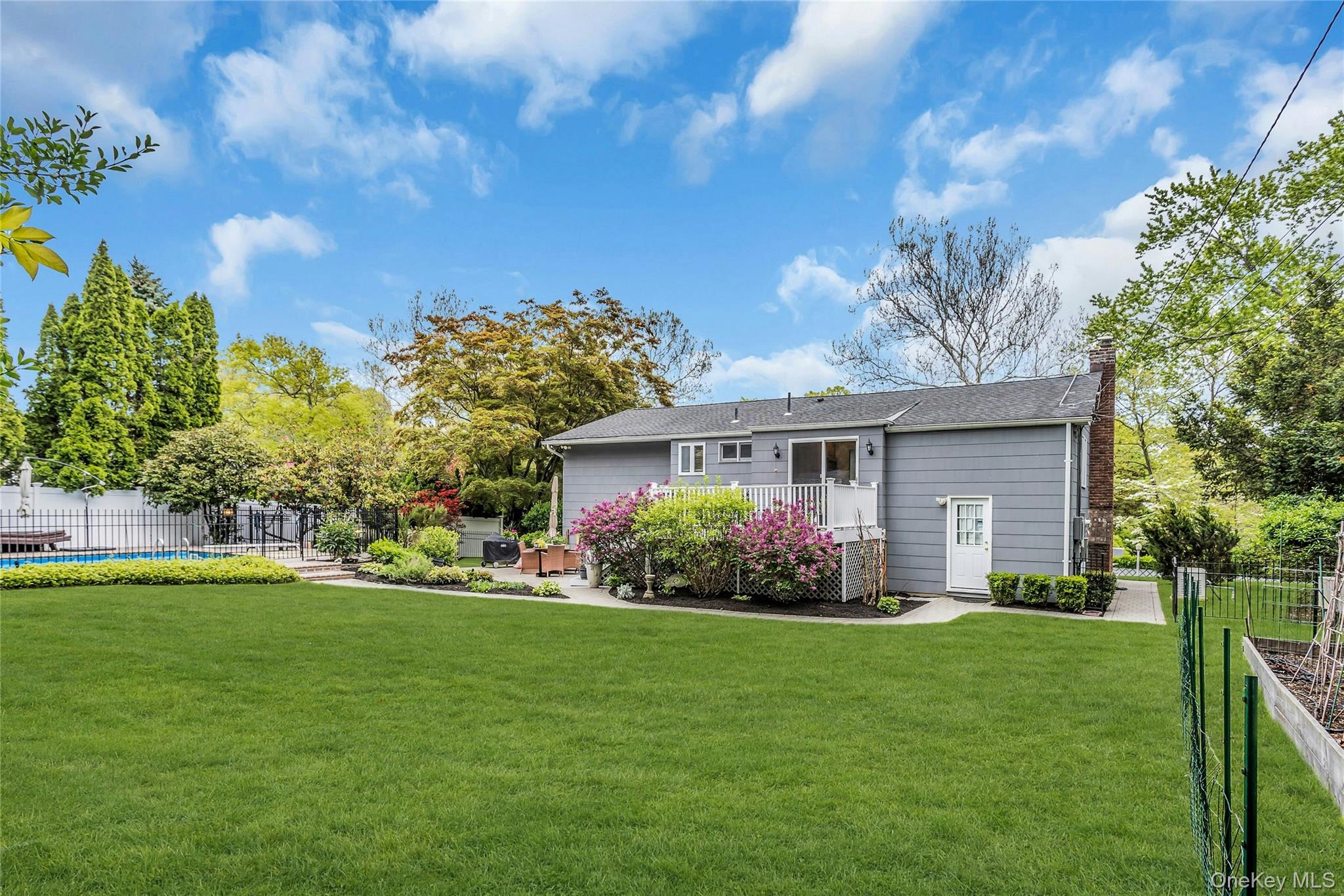 28 Penguin Lane Commack, NY 11725 - Photo 35 of 38 a front view of house with yard and green space