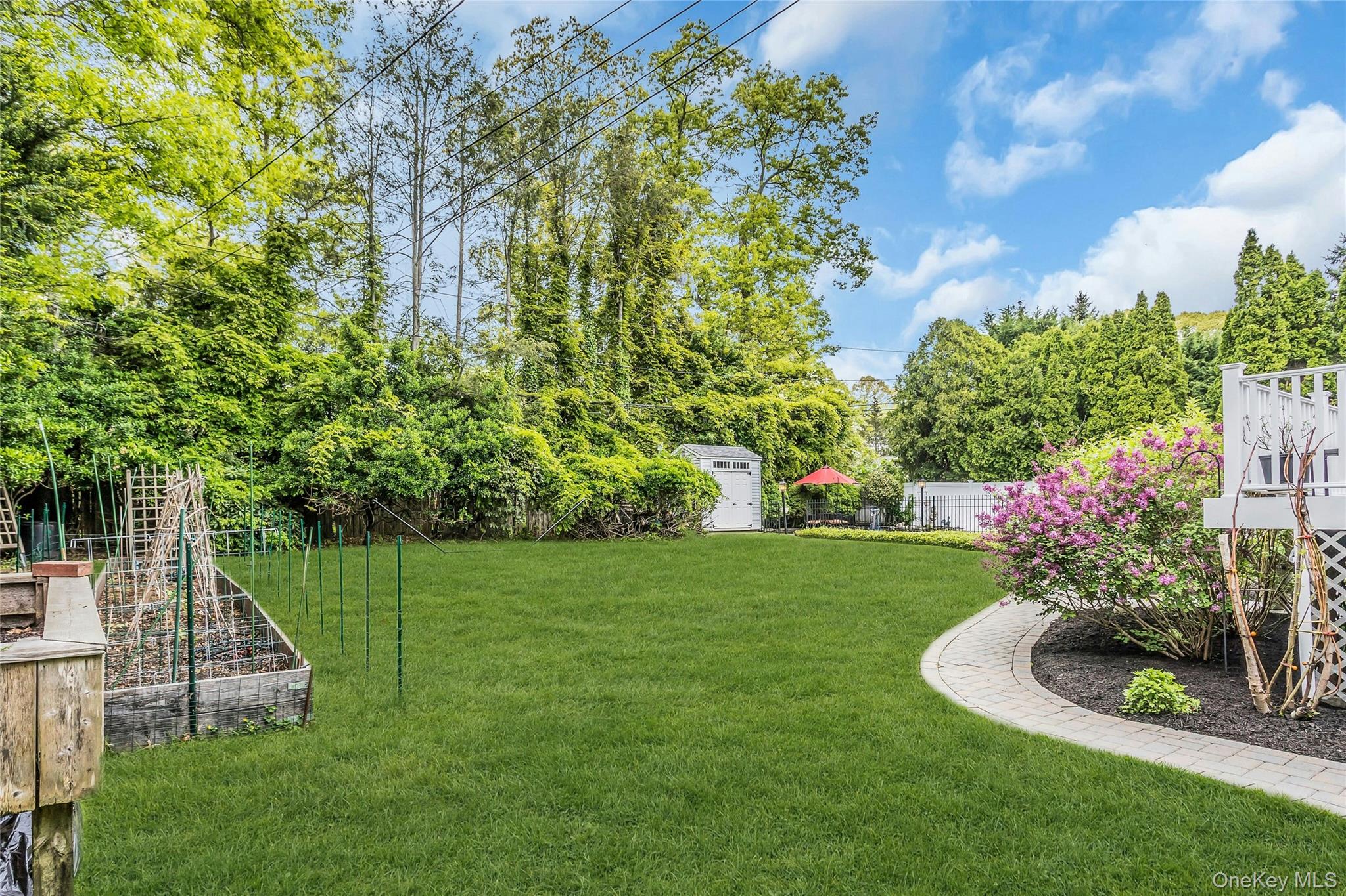 28 Penguin Lane Commack, NY 11725 - Photo 36 of 38 a view of a garden with a trampoline