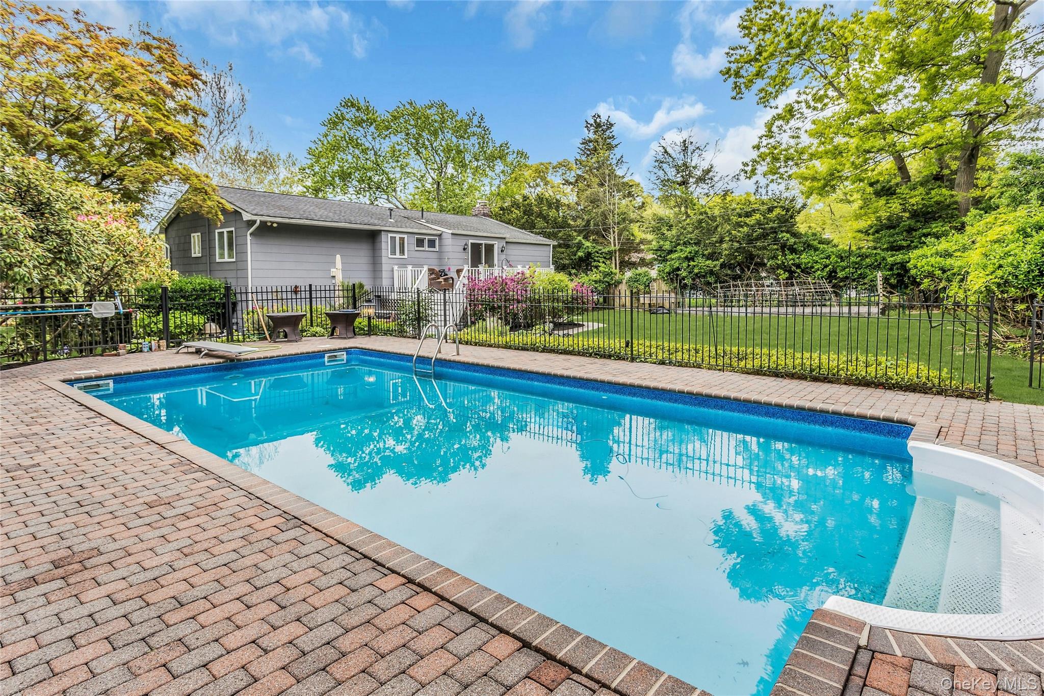 28 Penguin Lane Commack, NY 11725 - Photo 37 of 38 a view of swimming pool with a patio