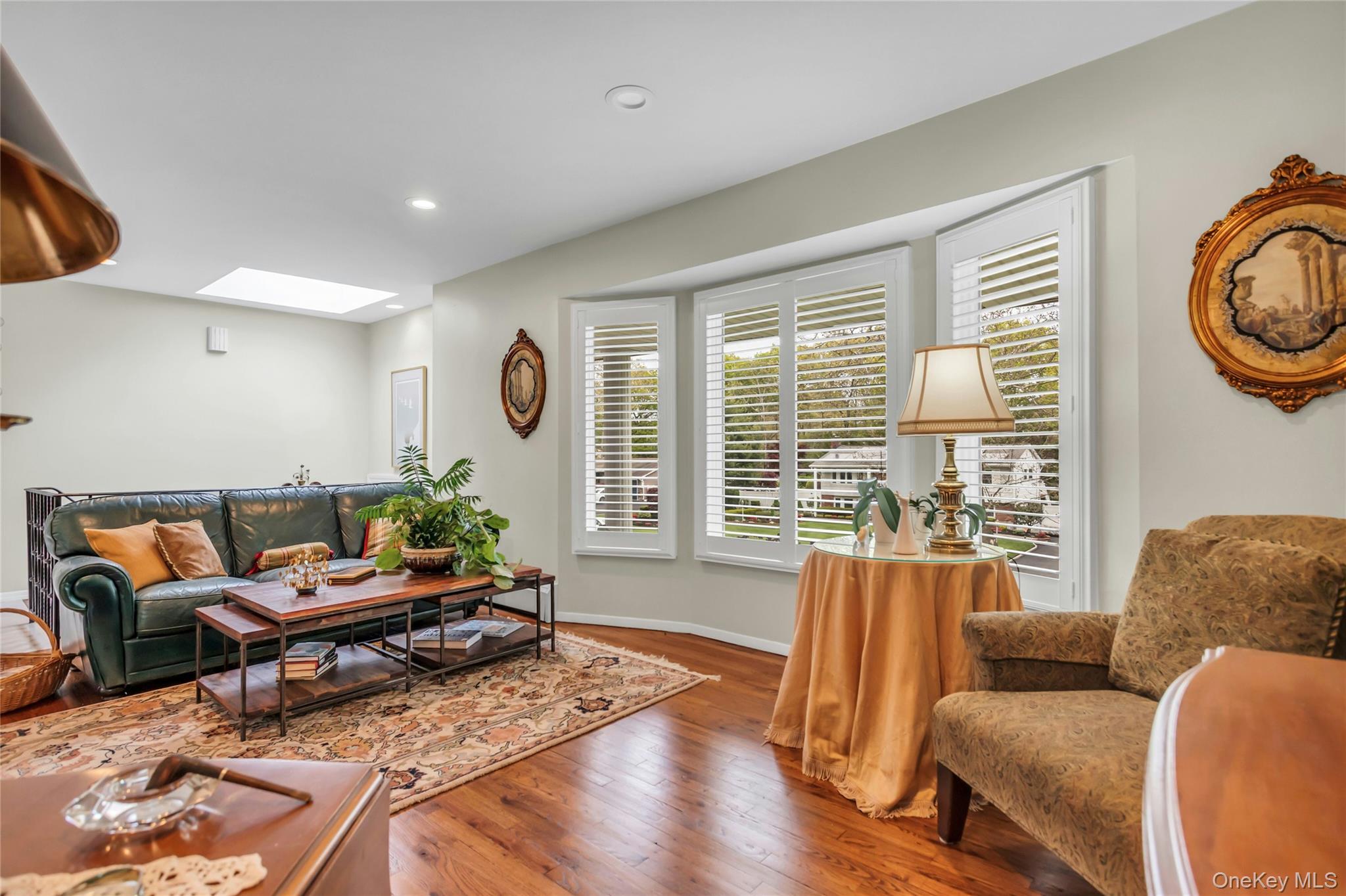 28 Penguin Lane Commack, NY 11725 - Photo 9 of 38 a living room with furniture and a large window