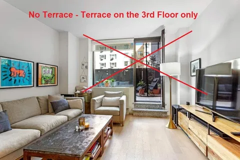 a kitchen with refrigerator and cabinets