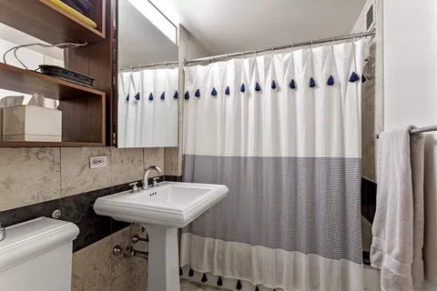 a bedroom with furniture and windows