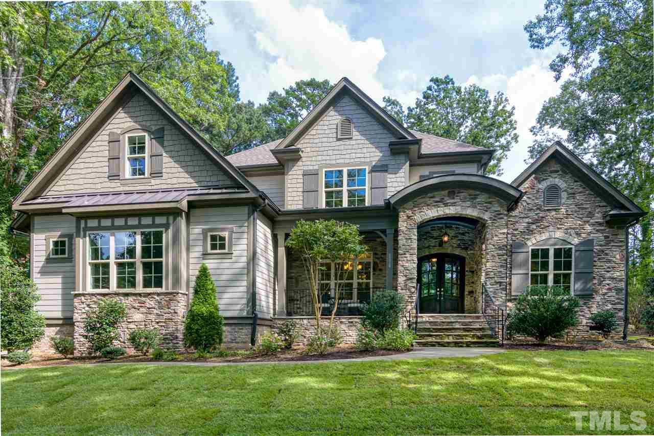 1216 Hunting Ridge Road Raleigh, NC 27615 - Photo 1 of 30 a front view of a house with a yard