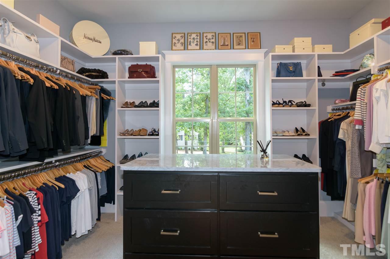 1216 Hunting Ridge Road Raleigh, NC 27615 - Photo 18 of 30 a view of walk in closet with clothes and shoes