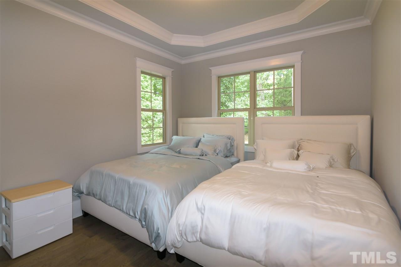 1216 Hunting Ridge Road Raleigh, NC 27615 - Photo 19 of 30 a bedroom with two beds and a window